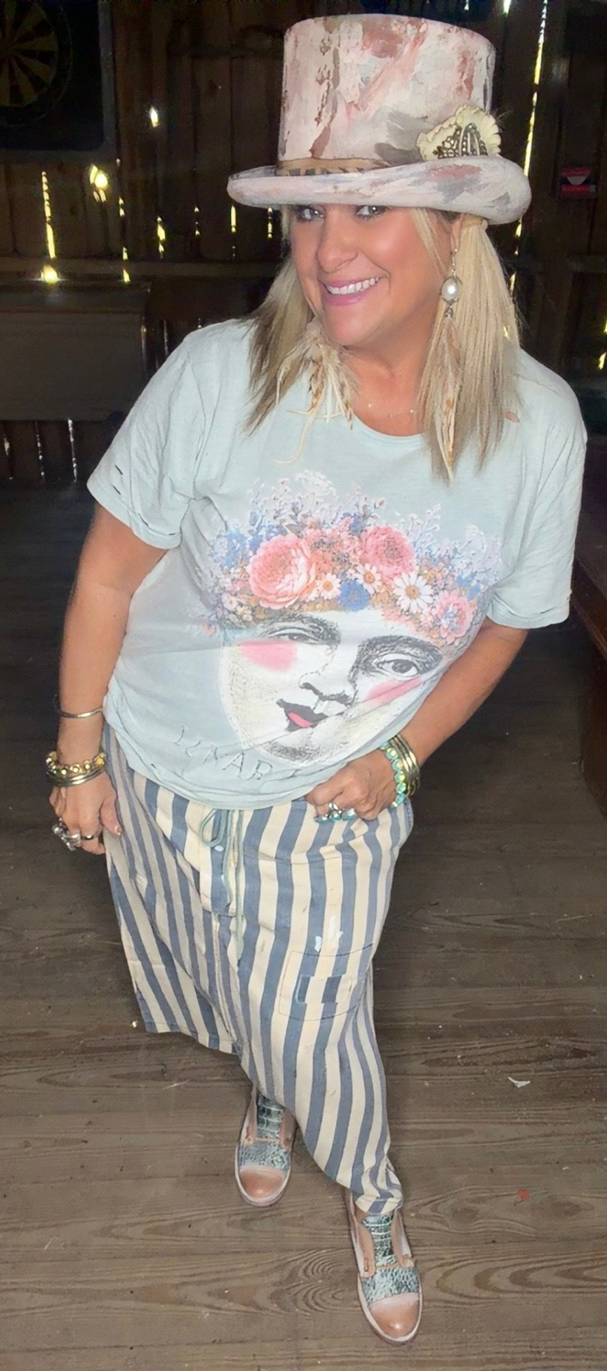 Woman wearing Earthsong Harem Pants in chambray stripe with a relaxed fit and drawstring waist.